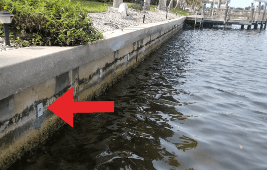 Seawall face after hydrostatic pressure relief and soil-loss repair